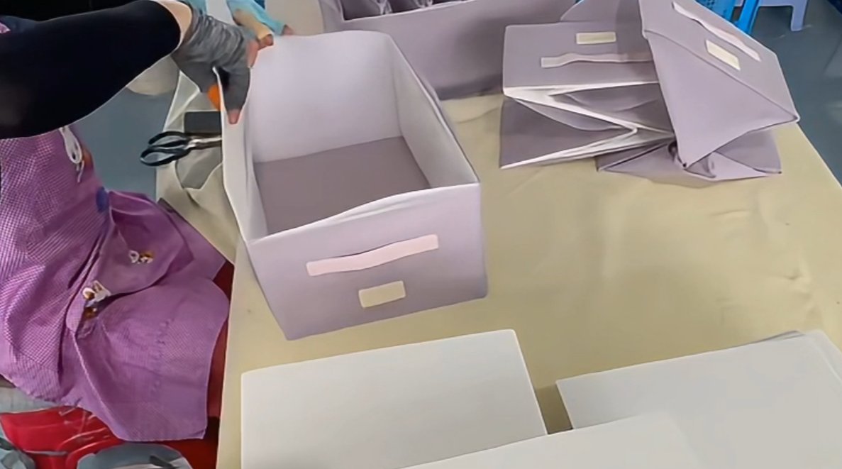 Assembly workshop — finished boxes ready for reinforcement and packing
